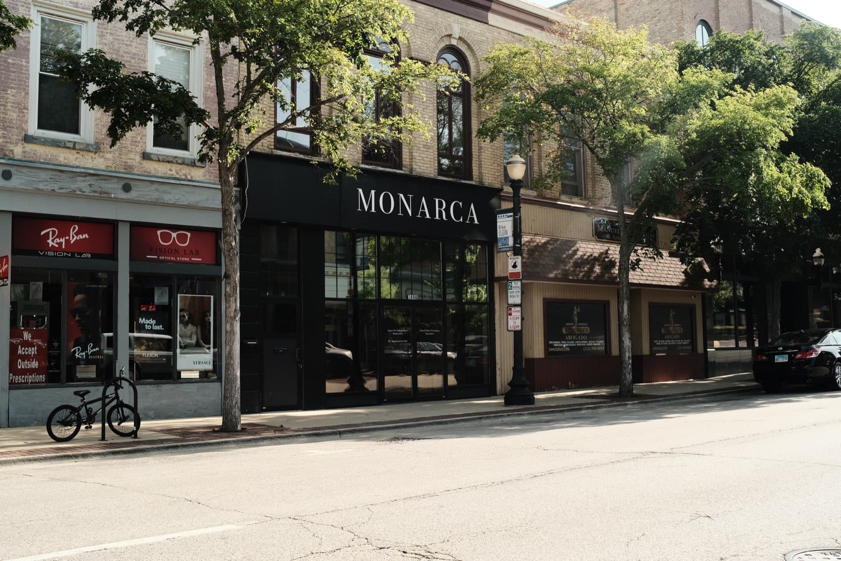 Monarca Salon Space storefront on the street in Elgin, Illinois